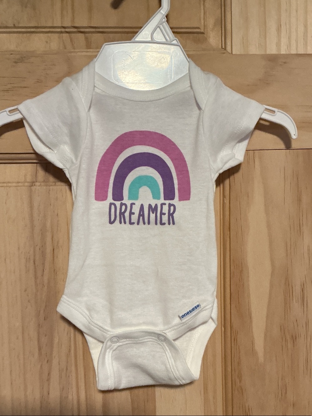 Dreamer Rainbow Graphic White Baby One-Piece